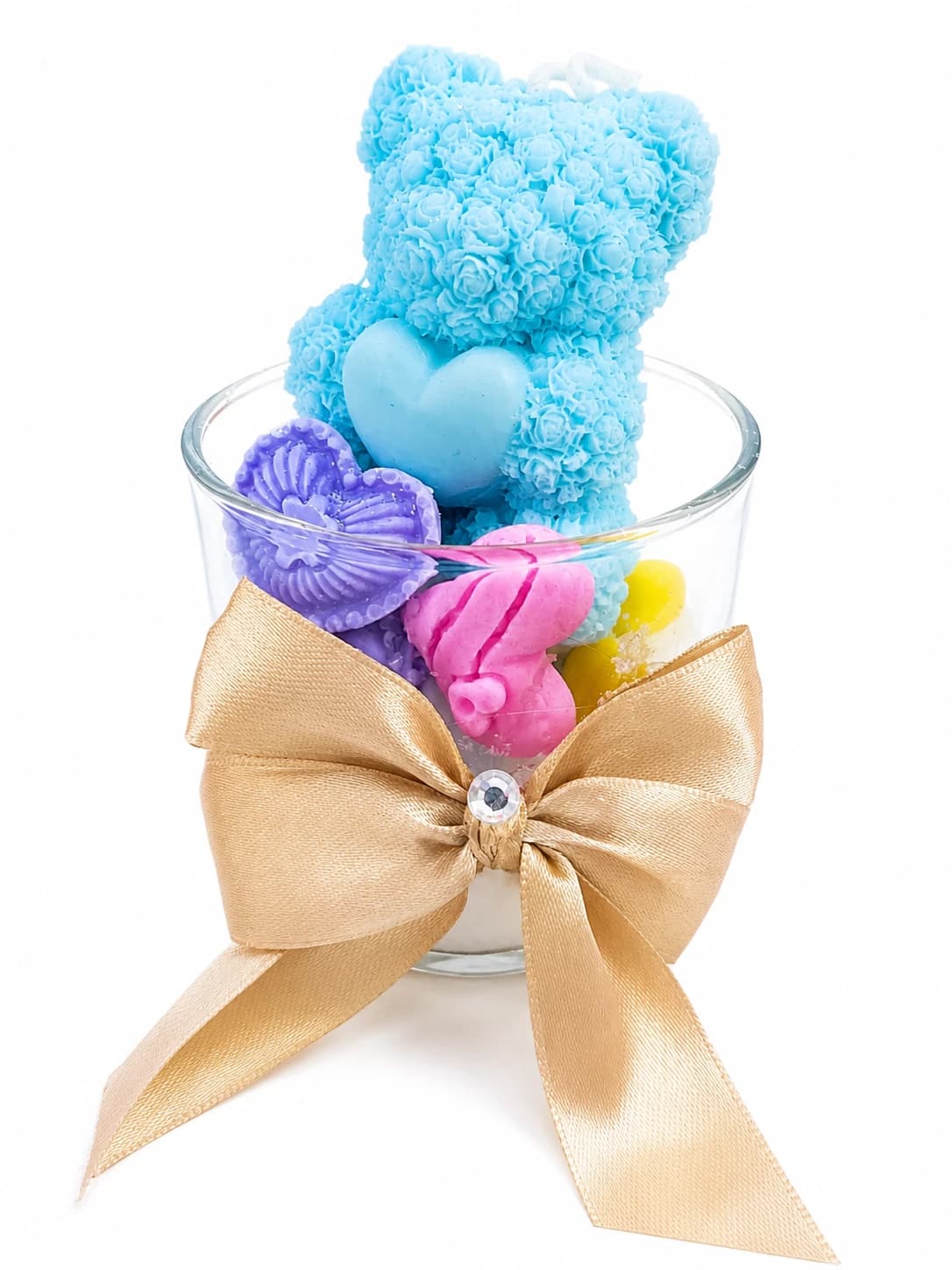 Vela aromática en forma de osito de rosas azul dentro de vaso de vidrio con lazo dorado